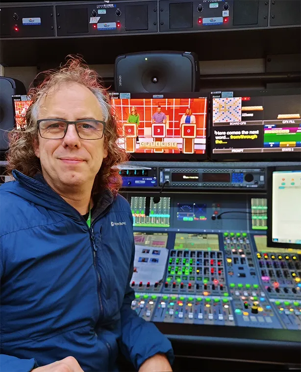Sound supervisor Ben Holland at the mixing desk of a mobile sound studio.