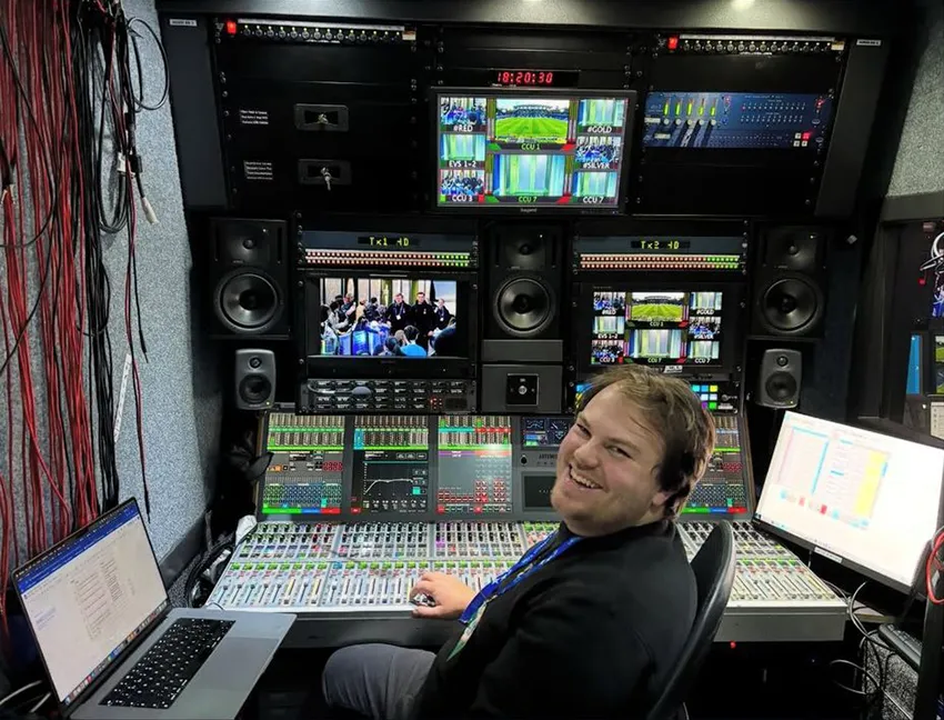Luke Phillips at the mixing desk of an outside broadcast unit.